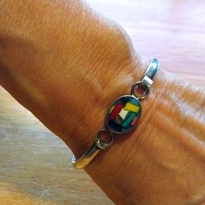 Thick sterling silver bracelet with dichroic glass fits med or large wrist .